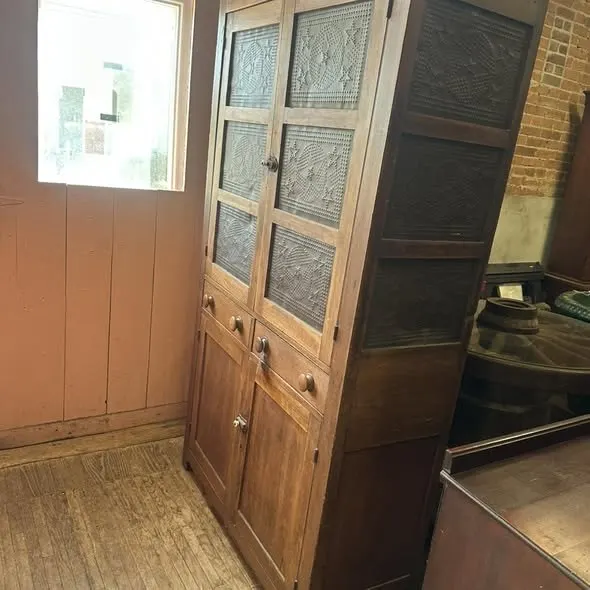 Tall wooden pie safe with punched-tin door panels