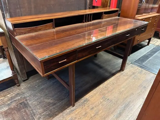 Long wooden mid-century-style writing desk